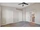 Main bedroom with carpet, ceiling fan, and access to closet and en-suite bath at 4717 Sabal Key Dr, Bradenton, FL 34203