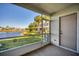 Screened-in patio with a view of the lake and the back of the home at 4717 Sabal Key Dr, Bradenton, FL 34203