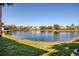 Lush green lawn with a beautiful pond view at 4717 Sabal Key Dr, Bradenton, FL 34203