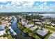Stunning aerial view of a waterfront community, showing canals, lush greenery and access to the open bay at 4721 Mount Vernon Dr, Bradenton, FL 34210