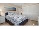 Comfortable bedroom with a large closet, stylish nautical themed bedding and coastal artwork at 4721 Mount Vernon Dr, Bradenton, FL 34210