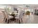 Bright dining room featuring stylish table and chairs, with natural light and a modern design at 4721 Mount Vernon Dr, Bradenton, FL 34210
