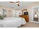 Spacious main bedroom with ceiling fan and dresser. Ensuite bathroom access at 4721 Mount Vernon Dr, Bradenton, FL 34210