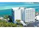 Stunning waterfront condo building boasting panoramic ocean views and lush landscaping at 4822 Ocean Blvd # 2D, Sarasota, FL 34242