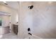 Bathroom features a shower and tub with white marble tile surround at 501 Reclinata Dr, Longboat Key, FL 34228