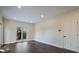 Bright bedroom featuring hardwood floors, recessed lighting and sliding glass doors to a balcony at 501 Reclinata Dr, Longboat Key, FL 34228