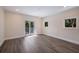 This spacious bedroom has sleek flooring, recessed lights, and a balcony entrance at 501 Reclinata Dr, Longboat Key, FL 34228