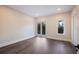 Bright bedroom features sleek flooring, recessed lighting, and a balcony entrance at 501 Reclinata Dr, Longboat Key, FL 34228
