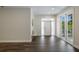 Inviting home foyer, with hardwood floors, opening to outdoor patio at 501 Reclinata Dr, Longboat Key, FL 34228