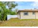 Backyard with a privacy fence, lush trees, and beautiful views at 5470 Ansonia Ter, North Port, FL 34287