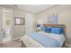 Comfortable bedroom features neutral walls, carpet floor, and ensuite access at 5556 Cantucci St, Nokomis, FL 34275