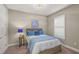 Cozy bedroom features neutral walls, carpet floor, window with plantation shutters, and ample light at 5556 Cantucci St, Nokomis, FL 34275