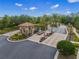 View of the gated community entrance with a guard house and lush landscaping surrounding the area at 5556 Cantucci St, Nokomis, FL 34275