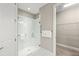Bright main bathroom features walk-in shower, quartz countertops, and walk in closet at 5556 Cantucci St, Nokomis, FL 34275