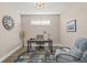 Inviting home office with hardwood floors and a cozy blue chair at 5556 Cantucci St, Nokomis, FL 34275