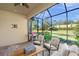 Relaxing screened patio area with grill and manicured lawn at 5556 Cantucci St, Nokomis, FL 34275