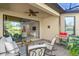 Relaxing covered patio with views of the backyard and an open living area at 5556 Cantucci St, Nokomis, FL 34275