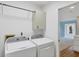 A bright laundry room with washer and dryer at 6414 13Th Avenue W Dr, Bradenton, FL 34209