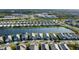 Overhead view of homes along a lakefront showcasing neat landscaping and a calm, inviting atmosphere at 8071 Slipway Dr, Sarasota, FL 34240