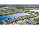 Aerial view of waterfront homes with lush green lawns along a serene and peaceful lake at 8071 Slipway Dr, Sarasota, FL 34240