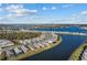 Stunning aerial view of lakeside community featuring beautiful homes and a picturesque waterfront at 8071 Slipway Dr, Sarasota, FL 34240
