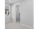 Bedroom with en-suite bathroom featuring natural light and a glass-enclosed shower at 8071 Slipway Dr, Sarasota, FL 34240