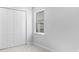 Comfortable bedroom with neutral walls, carpet, and a window with views of the outdoors at 8071 Slipway Dr, Sarasota, FL 34240
