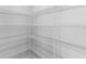 Spacious walk-in closet with white wire shelving, offering ample storage at 8071 Slipway Dr, Sarasota, FL 34240