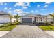 Charming home with a paved driveway and manicured landscaping at 8071 Slipway Dr, Sarasota, FL 34240