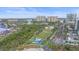 Wide aerial view of a city park with a playground and walking paths at 888 Blvd Of The Arts # 1008, Sarasota, FL 34236