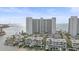Aerial view of a high-rise condo building with boats docked nearby at 888 Blvd Of The Arts # 1008, Sarasota, FL 34236