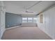 Spacious bedroom featuring neutral carpet, custom built-in closet and large windows that provide natural light at 888 Blvd Of The Arts # 1008, Sarasota, FL 34236