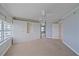 Bright bedroom with a large window, neutral carpet and custom built-in closet offering great storage at 888 Blvd Of The Arts # 1008, Sarasota, FL 34236
