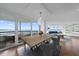 Well-lit dining room with water views and access to a balcony at 888 Blvd Of The Arts # 1008, Sarasota, FL 34236