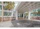 Elegant condo entrance with covered drop-off and well-manicured landscaping at 888 Blvd Of The Arts # 1008, Sarasota, FL 34236