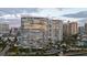 Beautiful waterfront condominium with private terraces and palm trees in a tropical setting at 888 Blvd Of The Arts # 1008, Sarasota, FL 34236