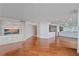 Open living room with hardwood floors, recessed lighting, and custom cabinets at 888 Blvd Of The Arts # 1008, Sarasota, FL 34236