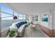 Stylish living room with floor to ceiling windows and a waterfront view at 888 Blvd Of The Arts # 1008, Sarasota, FL 34236