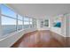 Bright living room with a custom built-in media center and a view of the water at 888 Blvd Of The Arts # 1008, Sarasota, FL 34236