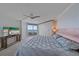 Spacious main bedroom features a private balcony, ceiling fan, and ample closet space at 888 Blvd Of The Arts # 1008, Sarasota, FL 34236