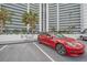 Electric car charging stations at a parking spot in front of a high rise condo at 888 Blvd Of The Arts # 1008, Sarasota, FL 34236