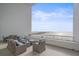 Outdoor patio overlooking the water, with comfortable seating and dining areas at 888 Blvd Of The Arts # 1008, Sarasota, FL 34236