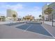 View of community tennis and pickleball courts with high rise condos in the background at 888 Blvd Of The Arts # 1008, Sarasota, FL 34236