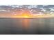 A panoramic waterfront sunset view with light dancing on the water at 888 Blvd Of The Arts # 1008, Sarasota, FL 34236