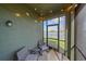 The screened in lanai has peaceful view of the lake at 10451 Ladybug Cv, Parrish, FL 34219