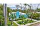 Aerial view of the home showcasing its manicured lawn, mature trees, and desirable neighborhood location at 115 24Th W St, Bradenton, FL 34205