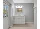 Nicely updated bathroom with modern mirror, vanity, and lighting at 115 24Th W St, Bradenton, FL 34205