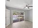This bedroom features sliding glass doors that open to a private pool and patio at 115 24Th W St, Bradenton, FL 34205