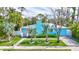 Charming home with a vibrant exterior, landscaped front yard and inviting walkway to the front entrance at 115 24Th W St, Bradenton, FL 34205