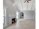Spacious living room featuring a cozy fireplace, large windows and light vinyl floors at 115 24Th W St, Bradenton, FL 34205